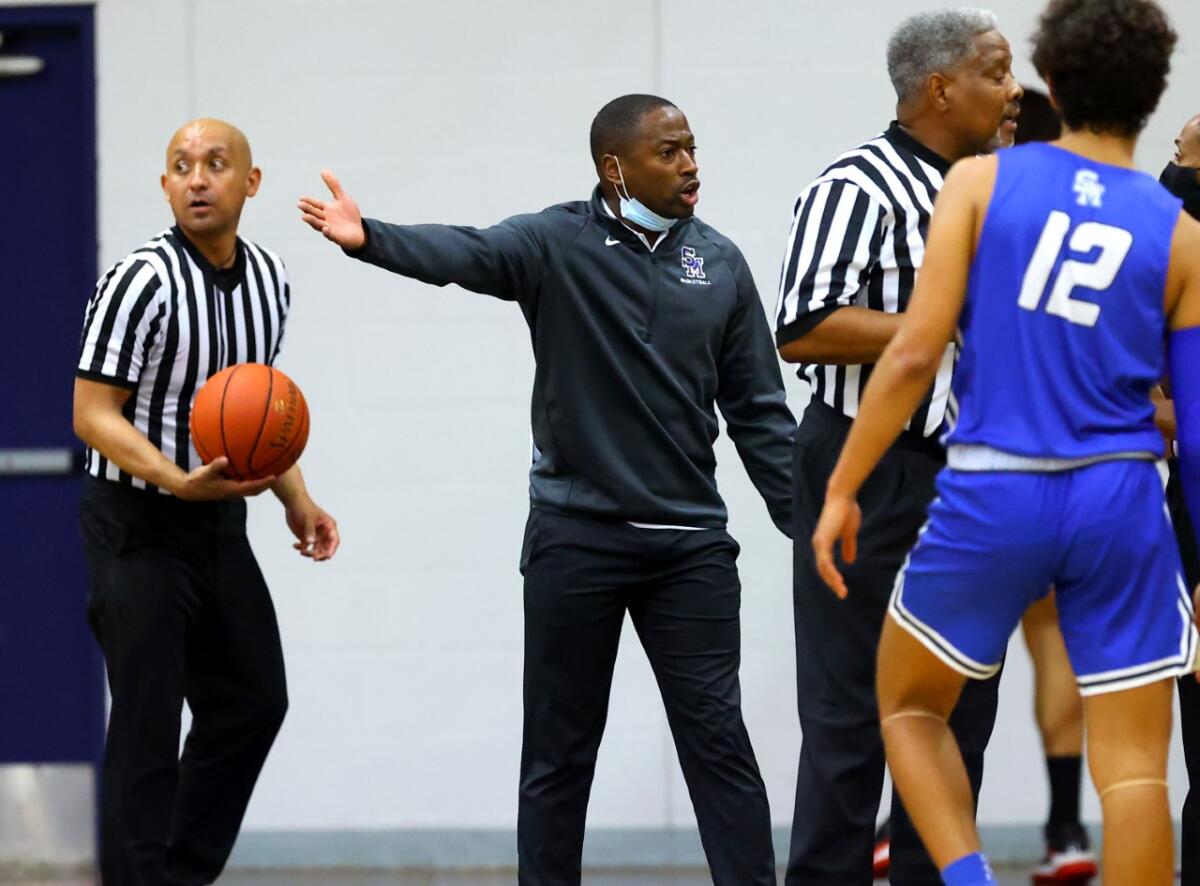 Santa Margarita basketball coach Justin Williams-Bell reacts from the sideline during a game.