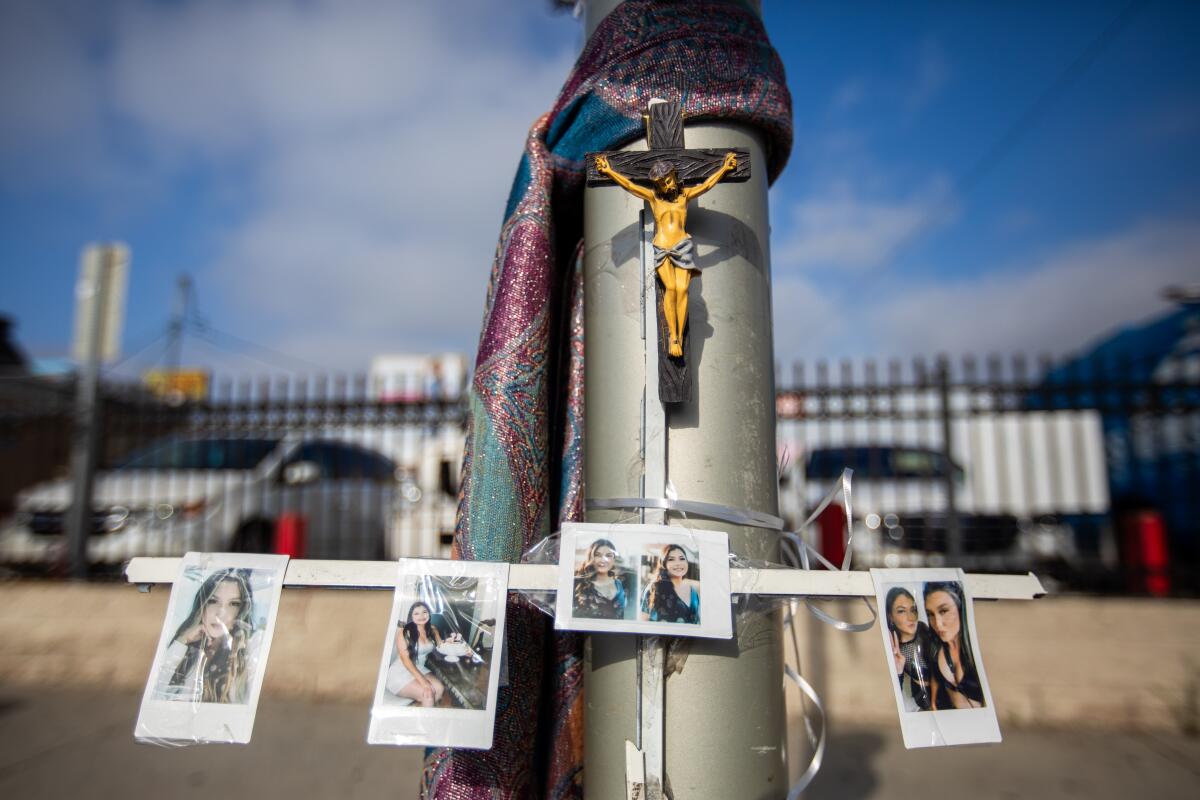 A makeshift memorial with photos of crash victims