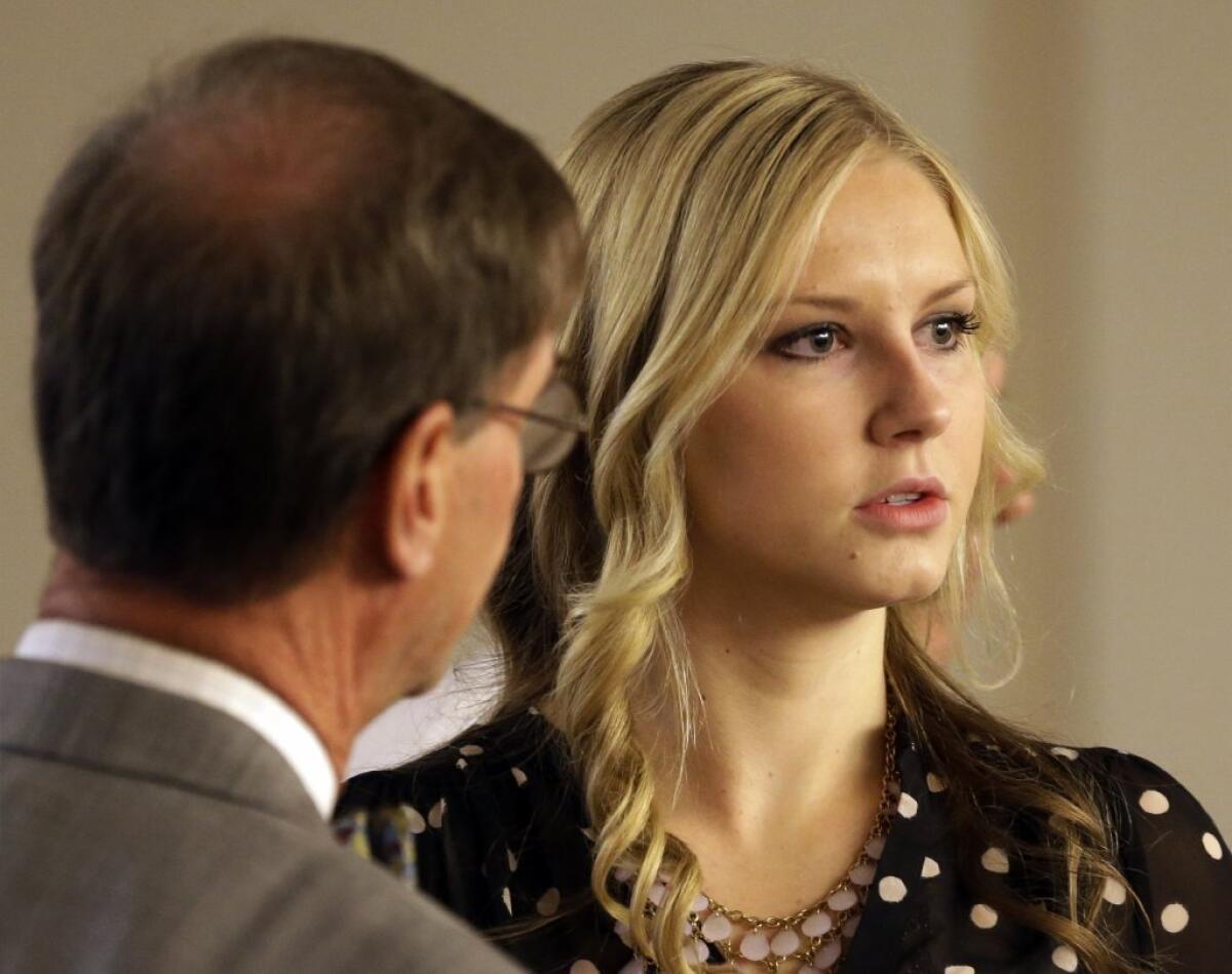 Kendra McKenzie Gill, 18, with her attorney before her court appearance in Salt Lake City. Gill, the former Miss Riverton, and three other teens accepted a plea deal after being accused of tossing homemade bottle bombs in a Salt Lake City suburb.
