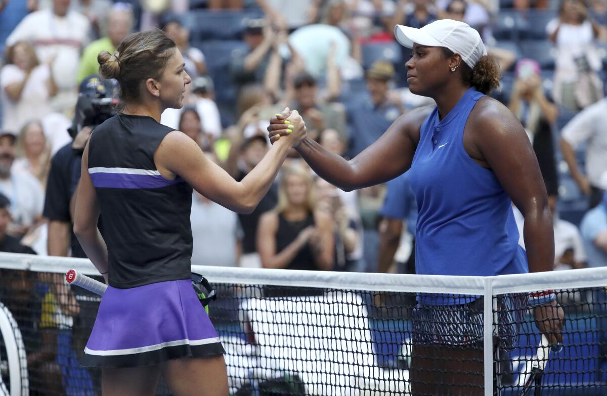 Simona Halep, left, congratulates Taylor Townsend, who won their second-round match in the US Open tennis championships.