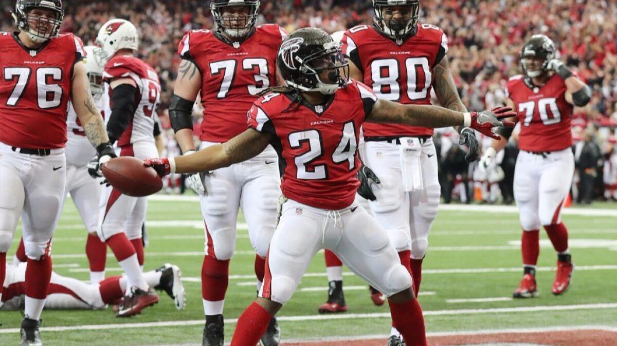 Falcons running back Devonta Freeman celebrates after scoring a touchdown against the Cardinals on Nov. 27.