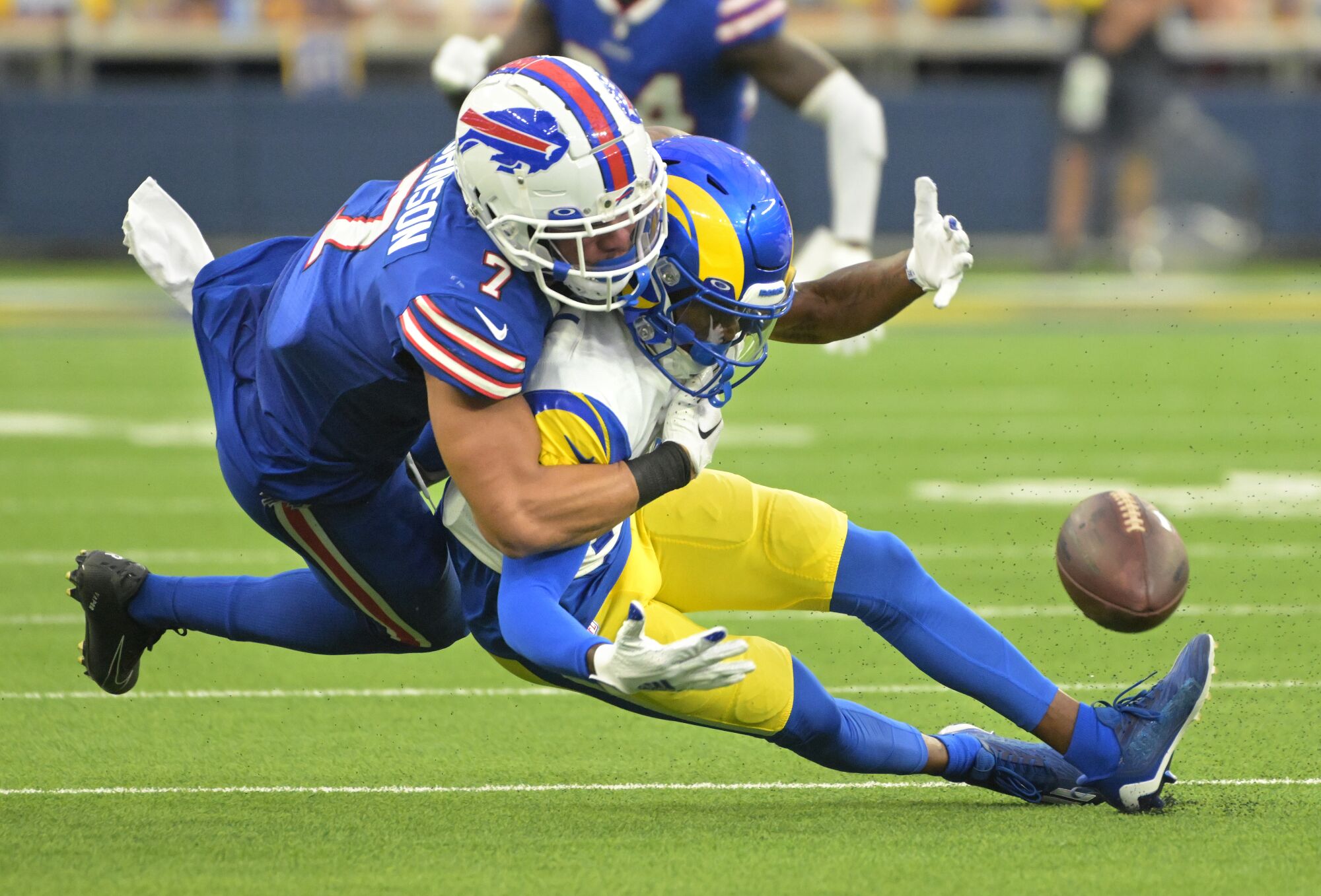 Rams receiver TuTu Atwell can't hold on to the ball while trying to make a catch as Bills cornerback Aaron Jonson defends.