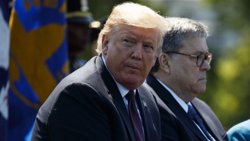 President Trump sits with Atty. Gen. William Barr at the U.S. Capitol on May 15, 2019. 
