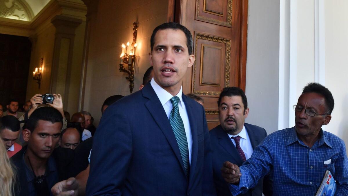 Venezuela's opposition leader and self-proclaimed acting president Juan Guaido arrives at the Federal Legislative Palace, which houses the National Assembly and the National Constitutional Assembly, to address the media in Caracas, on February 4, 2019.