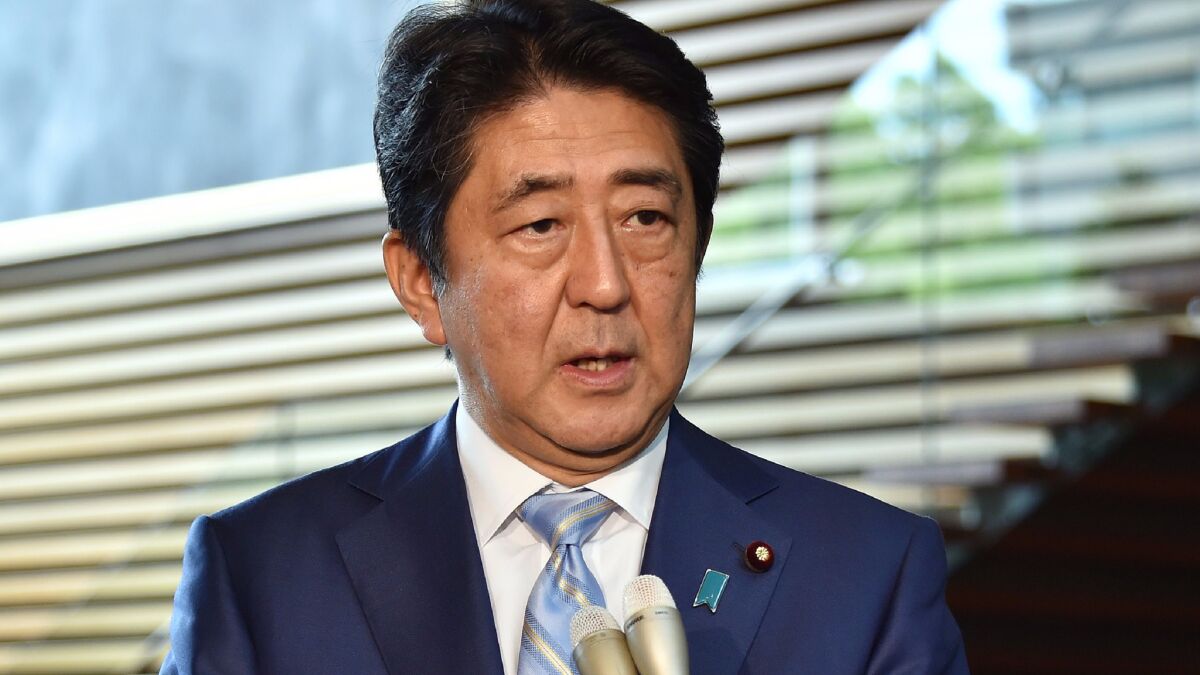 Japanese Prime Minister Shinzo Abe speaks to reporters at his official residence in Tokyo on August 3, 2016, after a ballistic missile launch by North Korea.