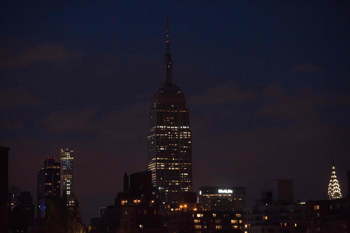 The Empire State Building in New York goes dark in reaction to the Orlando mass shooting.