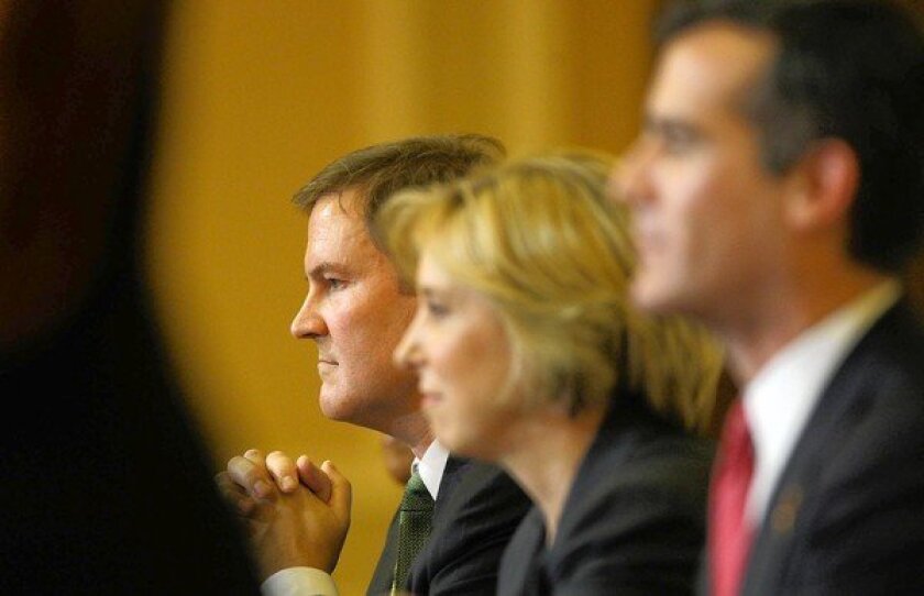 Los Angeles mayoral candidates, from left, Kevin James, Wendy Greuel and Eric Garcetti listen to a question during a debate in Hollywood. Before becoming a radio talk show host, James was an entertainment lawyer.