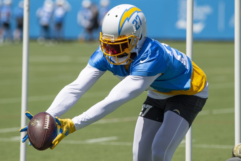 Chargers cornerback J.C. Jackson stretches to make a catch in practice on June 1.