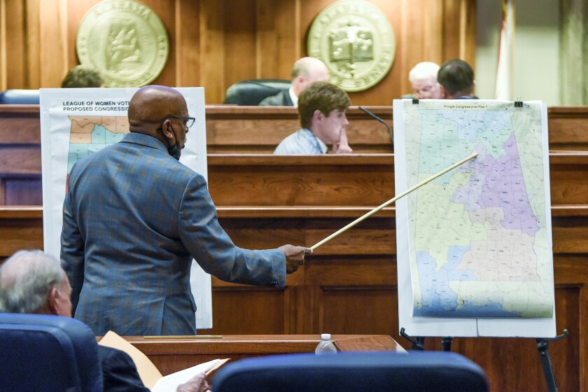 FILE - Sen. Rodger Smitherman compares U.S. Representative district maps during a special session on redistricting at the Alabama Statehouse in Montgomery, Ala., Nov. 3, 2021. Federal judges have blocked Alabama from using newly drawn congressional districts in upcoming elections. A three-judge panel issued a preliminary injunction Monday, Jan. 24, 2022. (Mickey Welsh/The Montgomery Advertiser via AP, File)