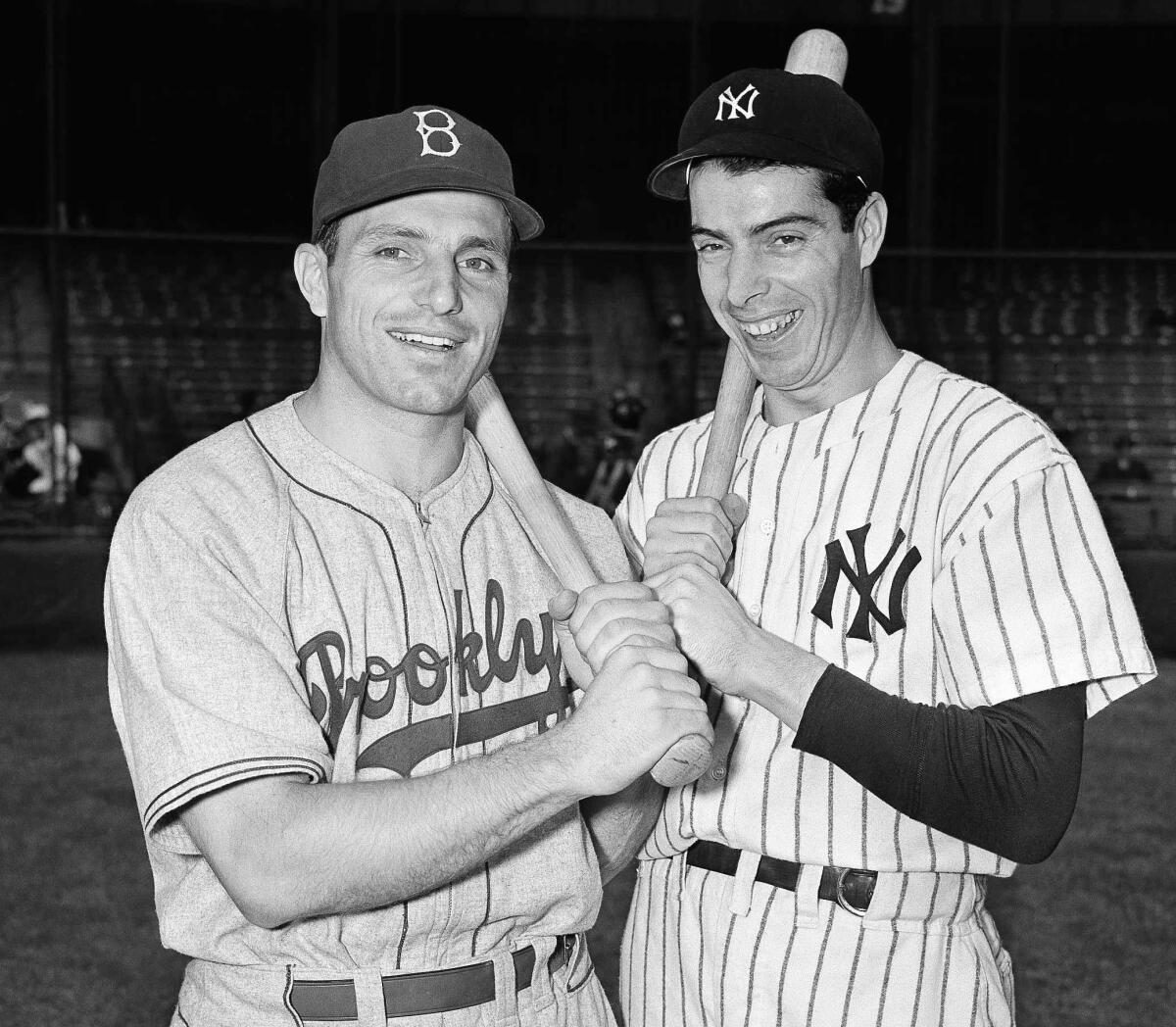 Brooklyn Dodgers first baseman Dolph Camilli, left, and New York Yankees center fielder Joe DiMaggio pose.