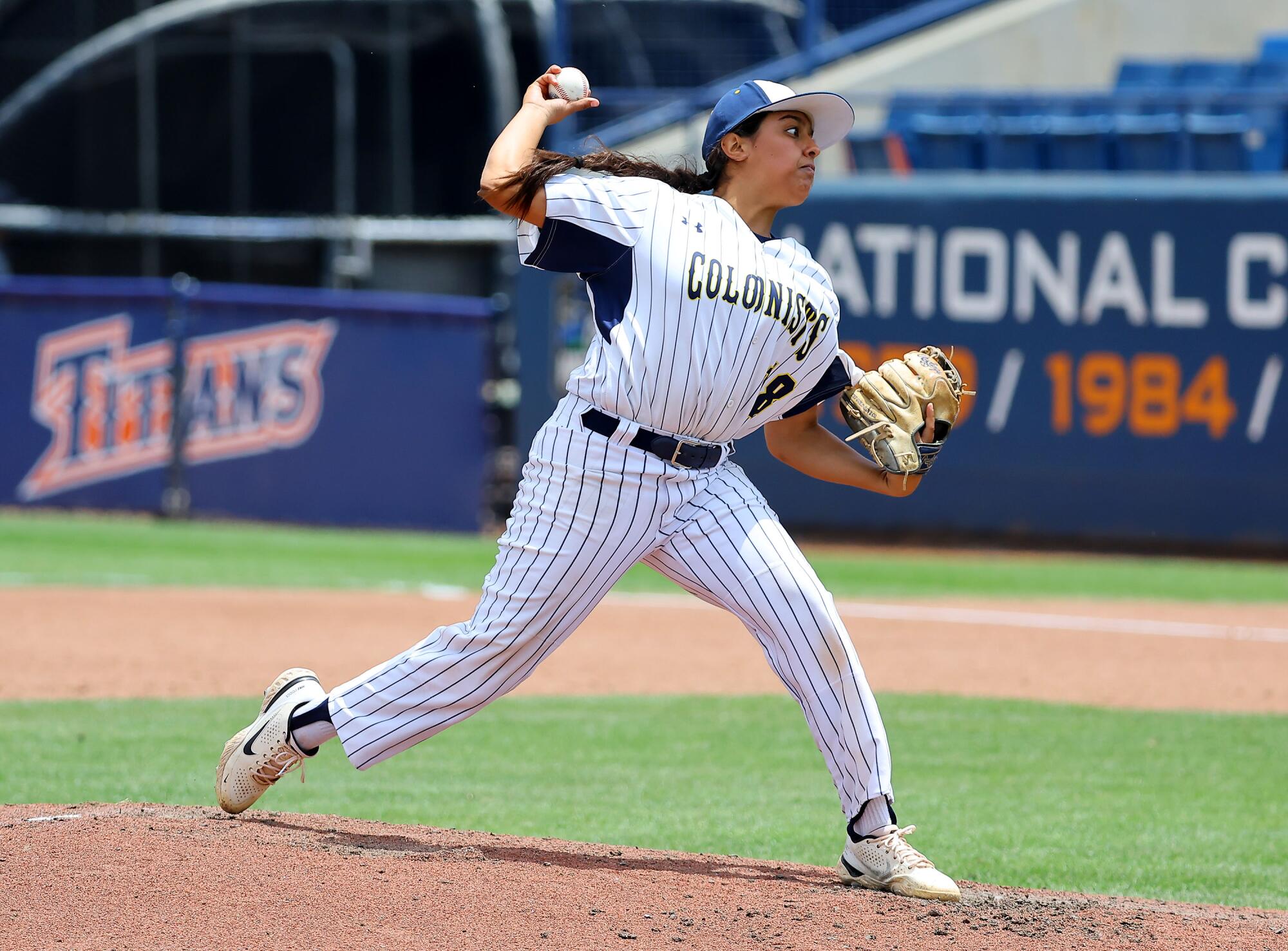 Jillian Albayati, of Anaheim High, throws from the mound during a high school game