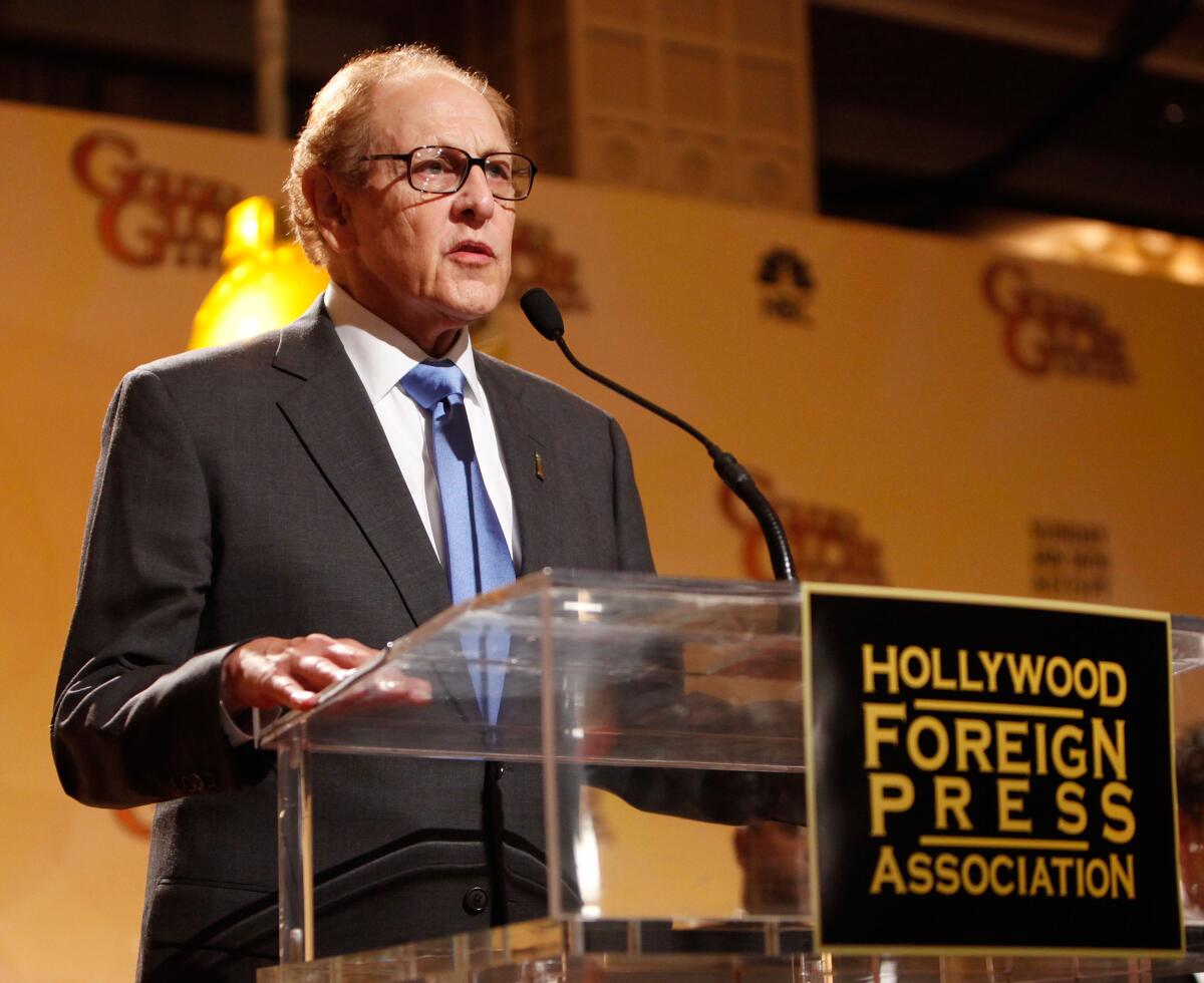 Philip Berk at a lectern with the words Hollywood Foreign Press Association