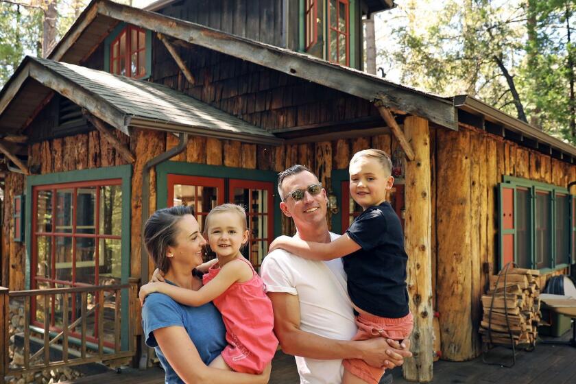 IDYLLWILD-CA-JUNE 28, 2018: The home of the Donovan family; Catherine, left, with Bon, 4, and Michael, right, with Tate, 7, in Idyllwild on Thursday, June 28, 2018. The family moved from Silver Lake two years ago. (Christina House / Los Angeles Times)