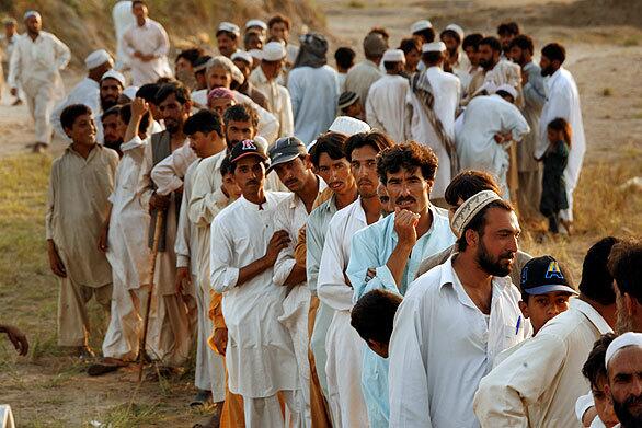 Refugees line up at a camp outside Swai as the Pakistani Red Crescent delivers cooking oil. The military says it has killed more than 1,200 militants in its campaign in the Swat Valley, and captured 79. About 8o Pakistani troops have died in the fighting.