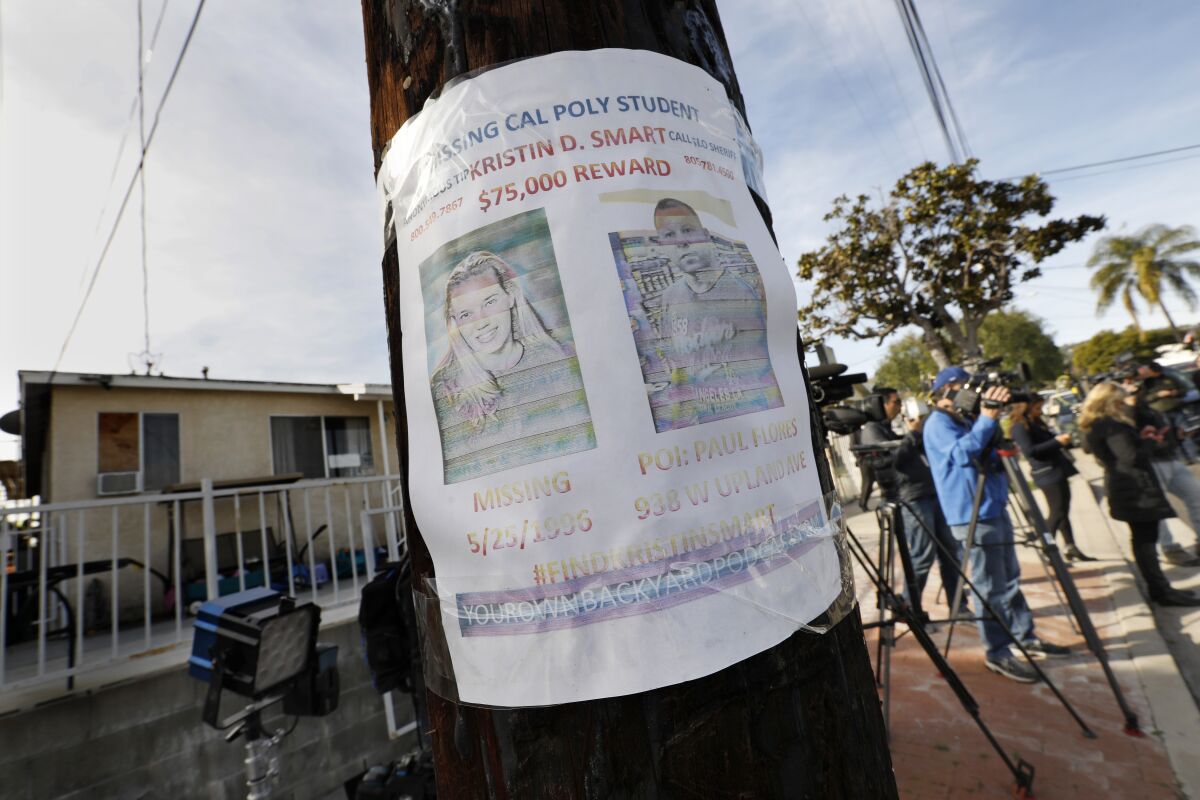 A missing person flyer is still posted on a telephone pole across the street from the home of Paul Flores in San Pedro.