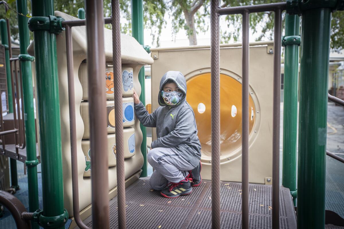 A student on playground equipment