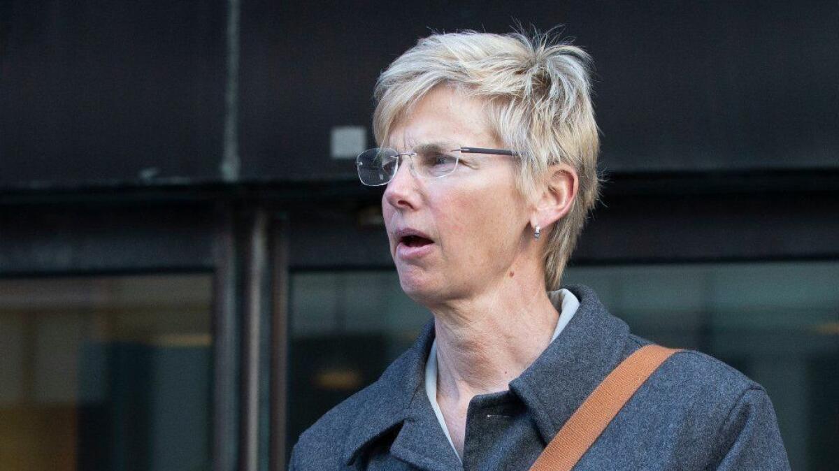 Former USC athletic administrator Donna Heinel, pictured in March exiting a federal court house in Boston, bought the Long Beach home in 2012 for $1.2 million. The property is now for sale at $1.998 million, records show.