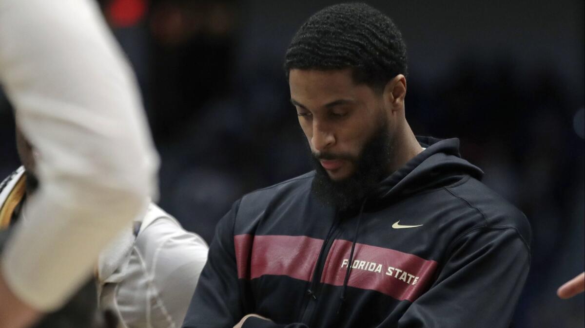 Florida State's Phil Cofer watches during a team huddle in the second half of a second-round men's college basketball game against Murray State in the NCAA tournament on Saturday in Hartford, Conn. Florida State won 90-62.