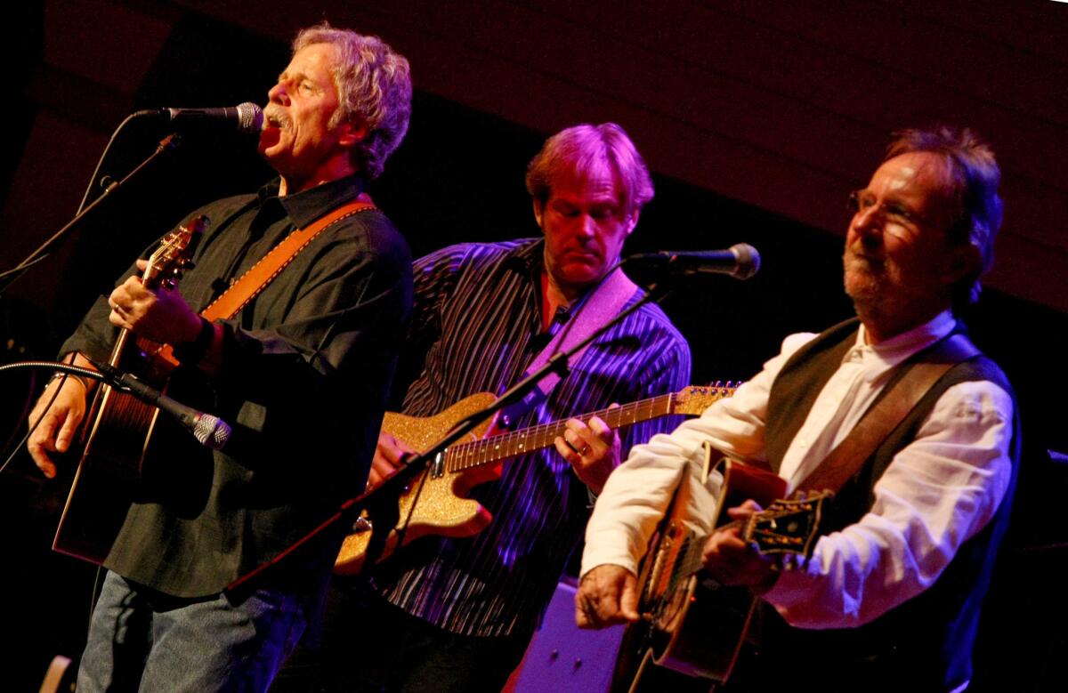 Desert Rose Band members, left to right, Chris Hillman, John Jorgenson and Herb Pedersen, perform in Bakersfield.