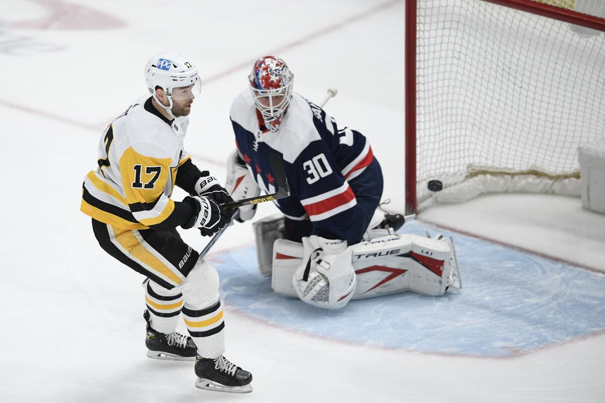 Pittsburgh Penguins right wing Bryan Rust (17) skates by after he scored a goal against Washington Capitals goaltender Ilya Samsonov (30) during the first period of an NHL hockey game Saturday, May 1, 2021, in Washington. (AP Photo/Nick Wass)