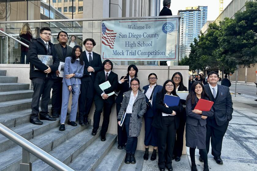 Students participants stand outside the San Diego Superior Court building on Union Street