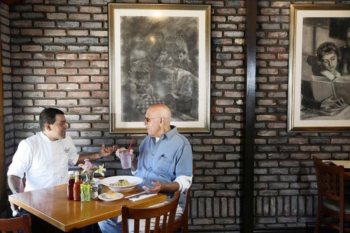 Phil Gittelman, right, has long rooted for Hugo's chef Nabor Diaz, who started there as a dishwasher 25 years ago.