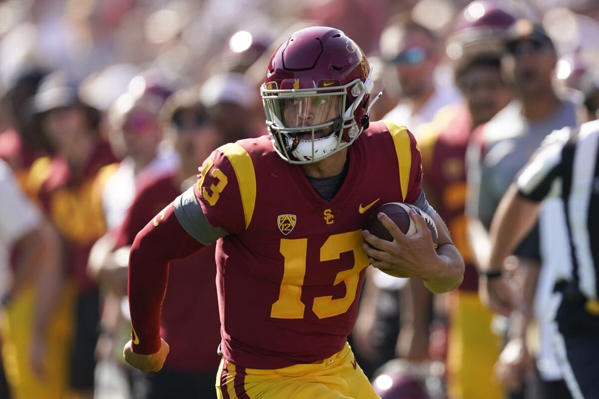 USC quarterback Caleb Williams runs the ball during during a blowout win over Rice at the Coliseum on Sept. 3.