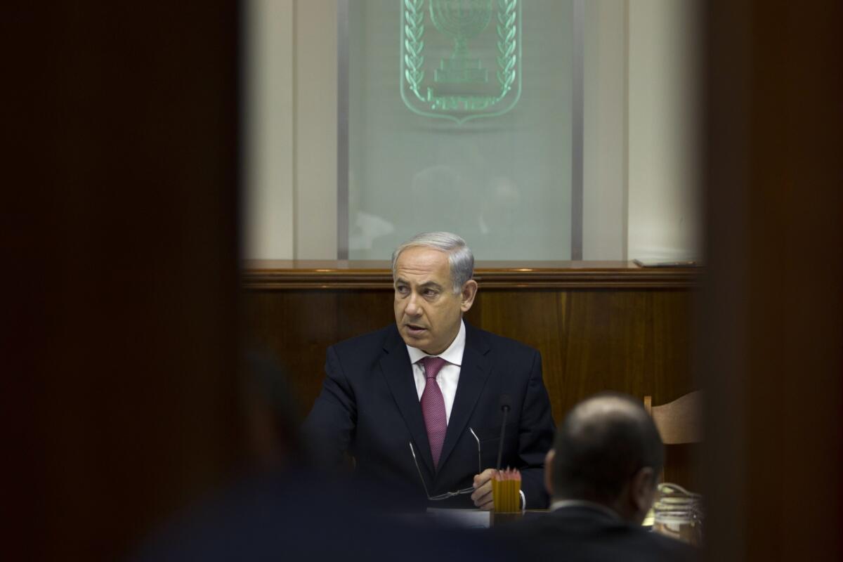 Israeli Prime Minister Benjamin Netanyahu attends the weekly cabinet meeting Sunday, during which his cabinet approved a release of Palestinian prisoners ahead of peace talks.