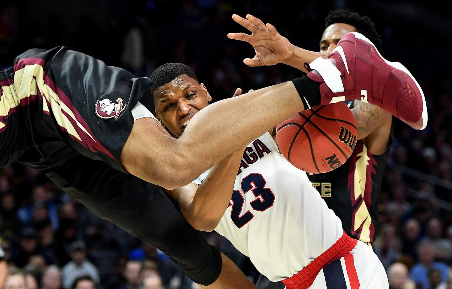 Gonzaga's Zach Norvell is fouled by Florida St.'s Ike Obiagu while attempting a shot in the 1st half in 3rd round of the NCAA Tournament at the Staples Center Thursday.