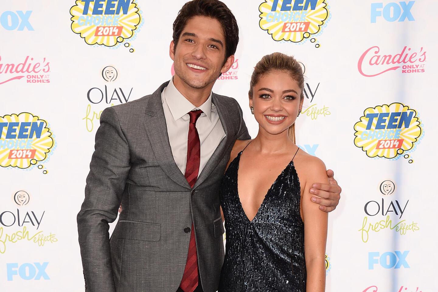 Tyler Posey and Sarah Hyland -- the show's hosts -- arrive at the Teen Choice Awards at the Shrine Auditorium in Los Angeles.