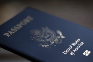 The cover of a U.S. Passport is displayed in Tigard, Ore., Saturday, Dec. 11, 2021. (AP Photo/Jenny Kane)