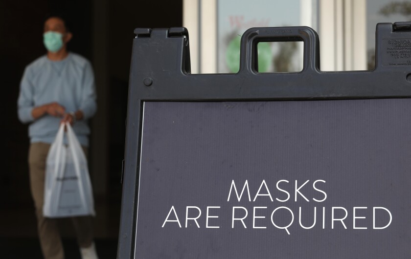 Customers are reminded they must wear masks at the Westfield Santa Anita shopping mall in Arcadia.