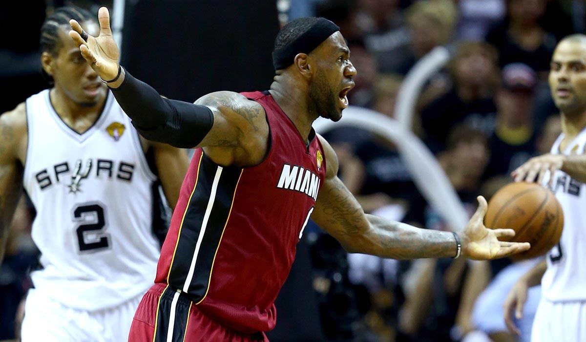 Heat forward LeBron James reacts after he was called for goaltending when tipping in a teammate's missed shot in Game 1.