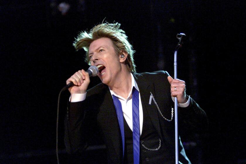 In this photo from August 2002, David Bowie performs at the Area2 Festival at the Verizon Wireless Amphitheater in Irvine.