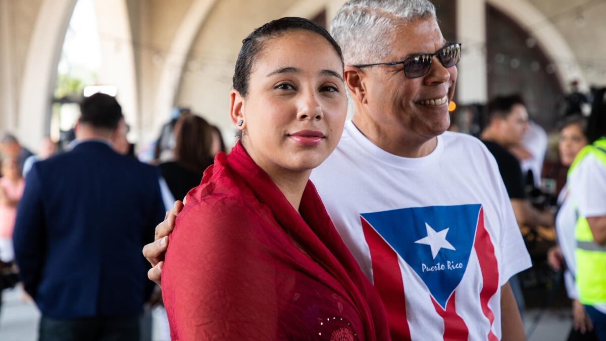 Mia Irizarry, 24, with Chicago Alderman Roberto Maldonado after speaking to the media at Humboldt Park Boat House in Chicago on July 13.