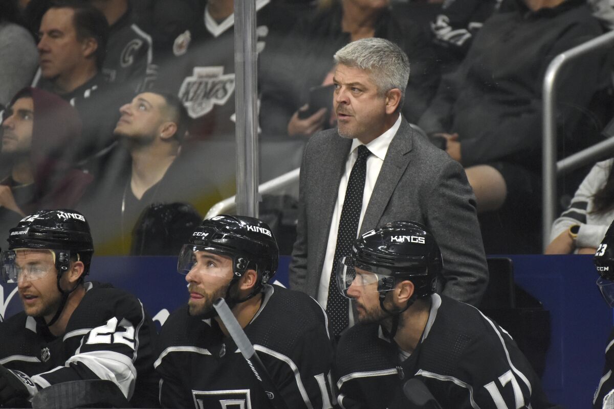 Kings coach Todd McLellan, center, looks on during a game against the Vegas Golden Knights in October 2019.