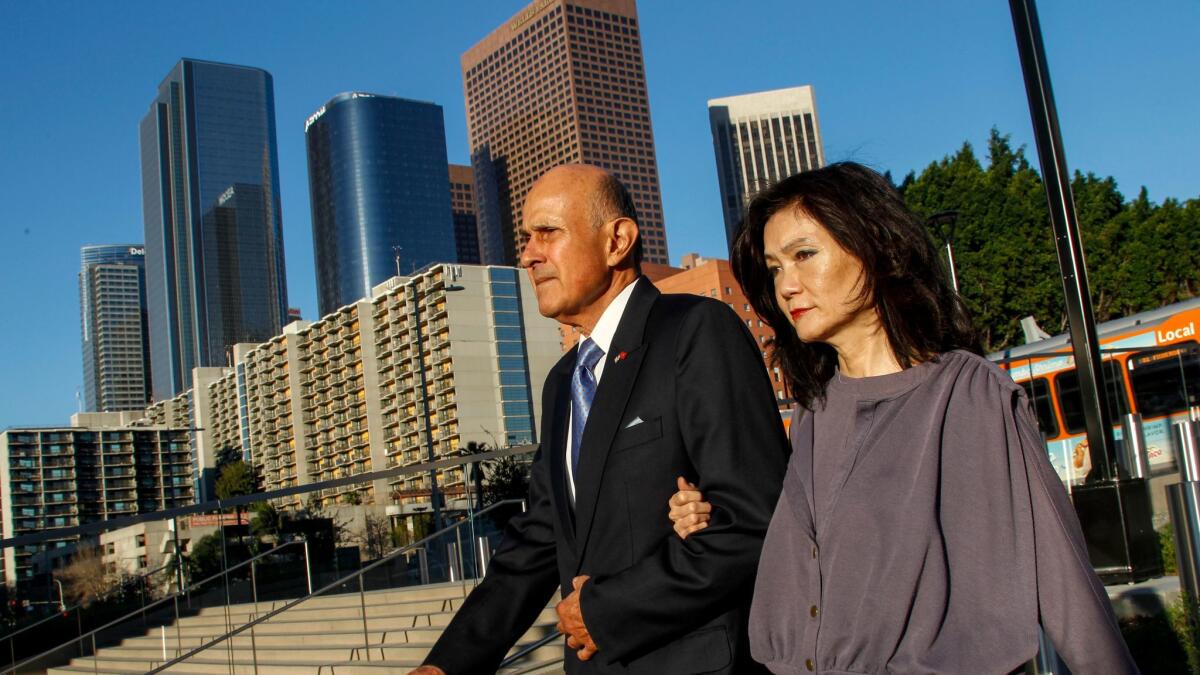 Former Los Angeles County Sheriff Lee Baca, left, with his wife, Carol Chiang, arrive at federal court earlier this month. Baca is charged with obstruction of justice, conspiracy and making false statements to federal investigators.
