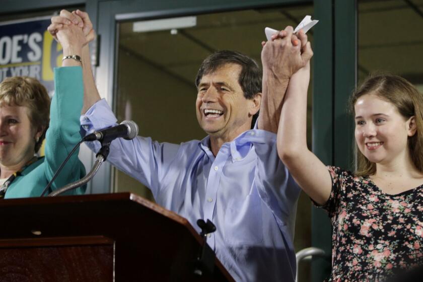 FILE - In this April 26, 2016, file photo, former Congressman Joe Sestak, center, his wife Susan Sestak, left, and daughter Alex Sestak react after speaking to supporters gathered outside his campaign headquarters in Media, Pa. Sestak has become the latest Democrat to enter the presidential race. The retired Navy admiral who calls himself "Admiral Joe" on his campaign website joins a crowded Democratic field seeking the nomination to challenge President Donald Trump. He was launching his longshot candidacy Sunday, June 23, 2019, at a veterans' museum in Waterloo, Iowa. (AP Photo/Matt Slocum, File)
