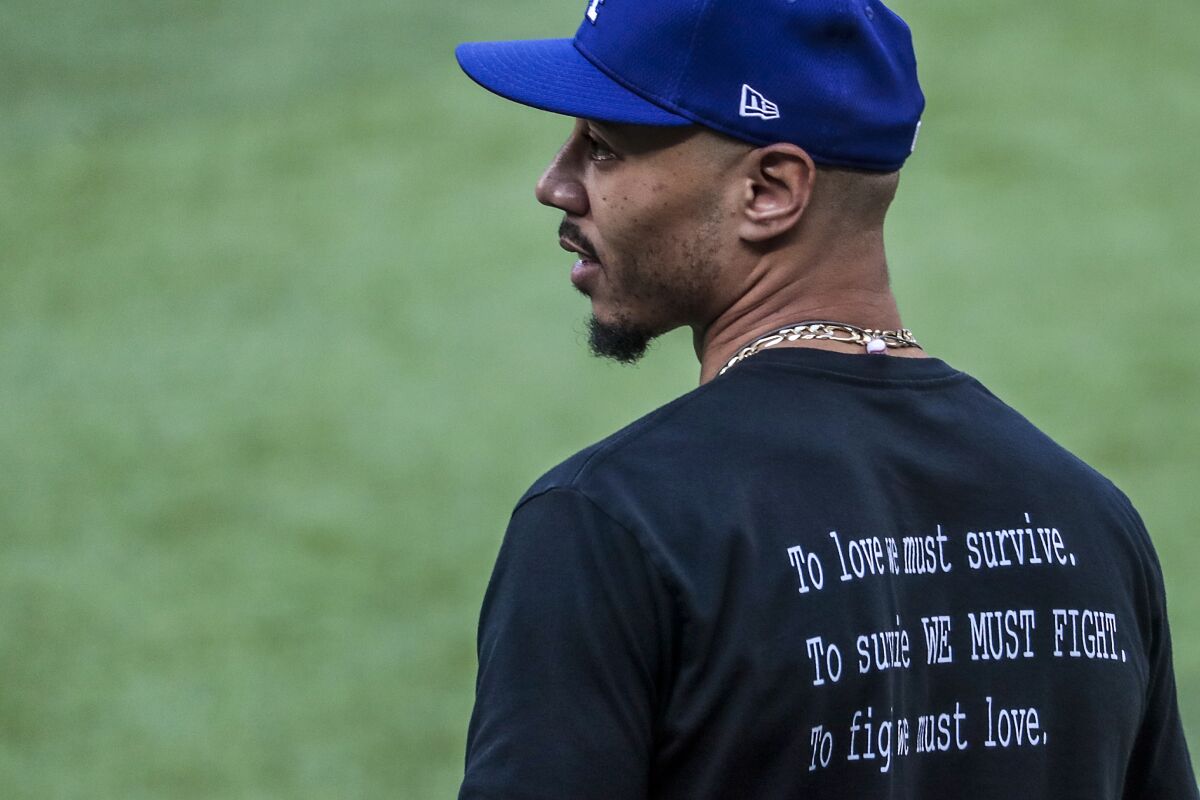 Mookie Betts' shirt makes a statement during workouts before the Dodgers' National League Division Series against Atlanta.