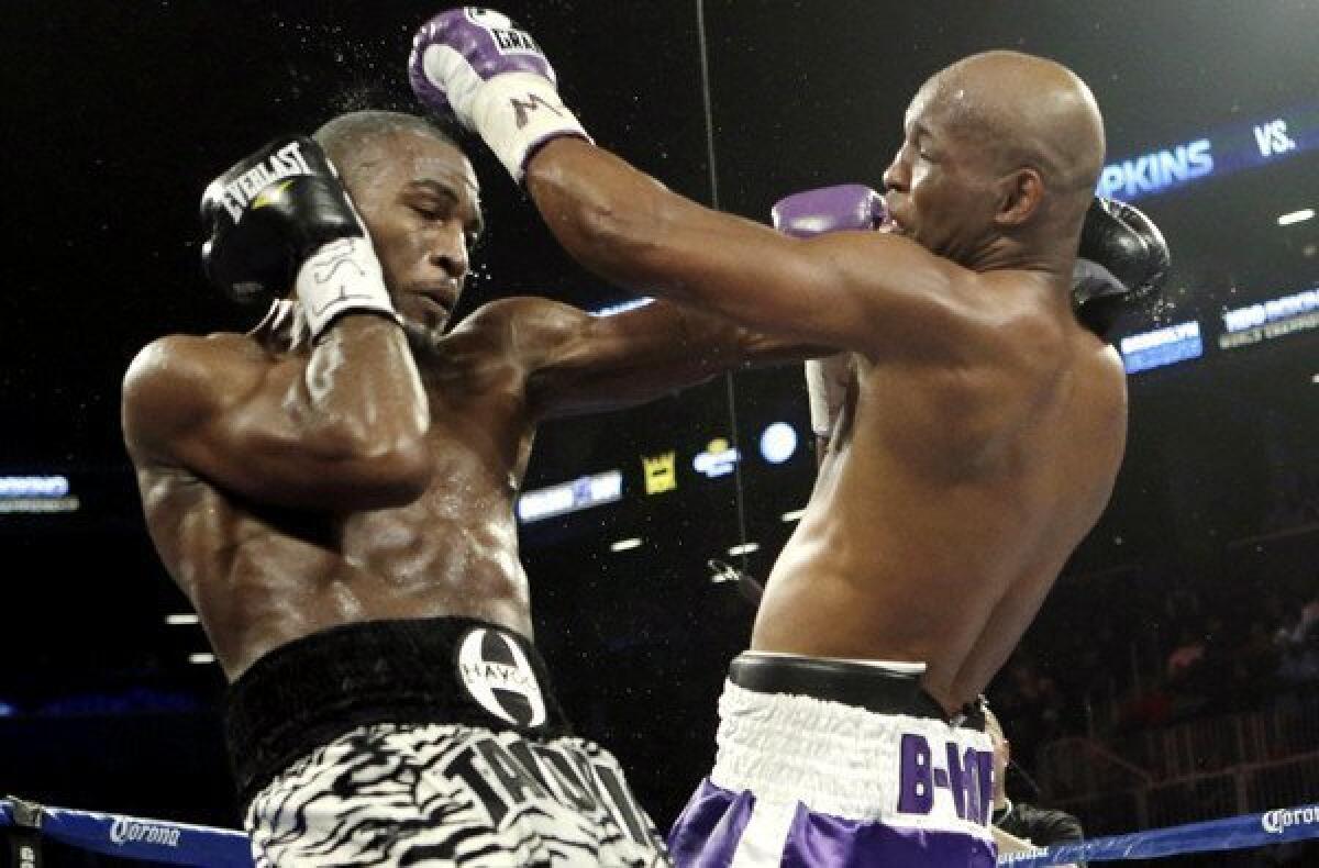 Bernard Hopkins lands a left against Tavoris Cloud in the fifth round of their IBF light-heavyweight fight on Saturday night at the Barclays Center in New York.