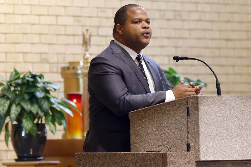 FILE - Dallas Mayor Eric Johnson speaks to those congregated during the funeral Mass for Dallas Police Officer Jacob Arellano at St. Paul Catholic Church in Richardson, Texas, Wednesday, Oct. 19, 2022. Johnson said Friday, Sept. 22, 2023, that he is switching political parties, making the city the largest in the nation led by a GOP mayor. (Tom Fox/The Dallas Morning News via AP, Pool)