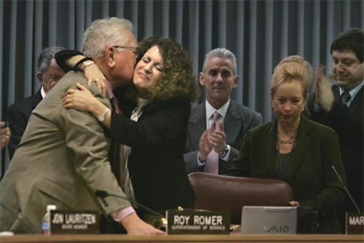 Farewell: With hugs and impromptu speeches, school board members salute Roy Romer, who ended his six-year tenure as superintendent of Los Angeles schools on Tuesday.