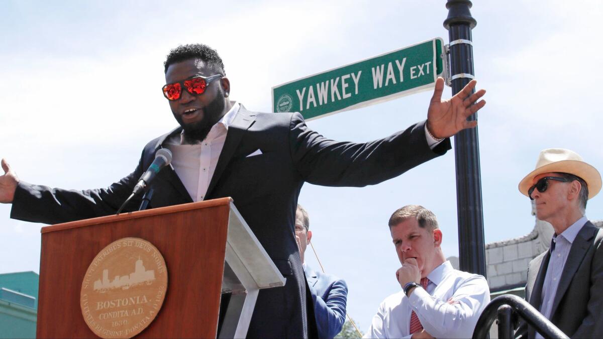Retired Boston Red Sox designated hitter David Ortiz is honored with the renaming of a portion of Yawkey Way to David Ortiz Drive outside Fenway Park in Boston on June 22.