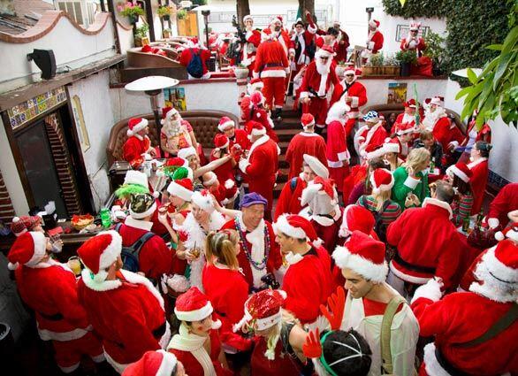 As Santacon progressed, Santas flooded El Cid with dozens remaining outside after the bar reached capacity.
