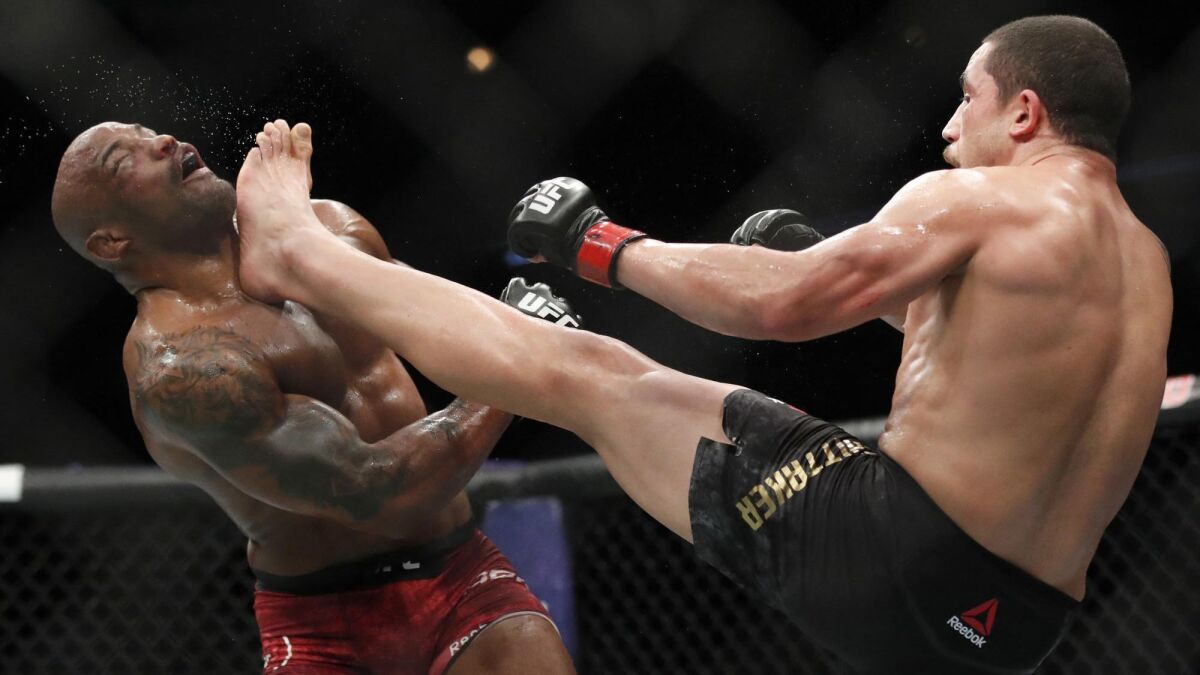 Robert Whittaker, right, defeated Yoel Romero on June 10, 2018, in Chicago. Whittaker, who hasn't fought since, returns Saturday to face Israel Adesanya at UFC 243 in Melbourne, Australia.