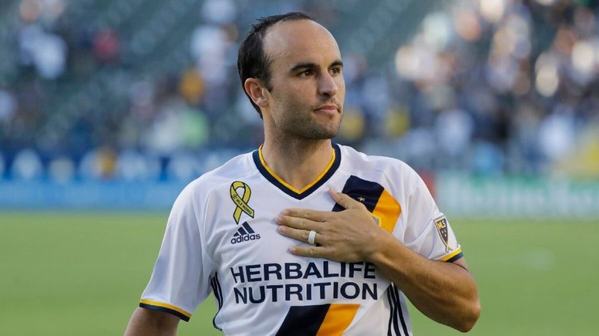 Landon Donovan aknowledges the crowd at StubHub Center after a game against Orlando City on Sept. 11.