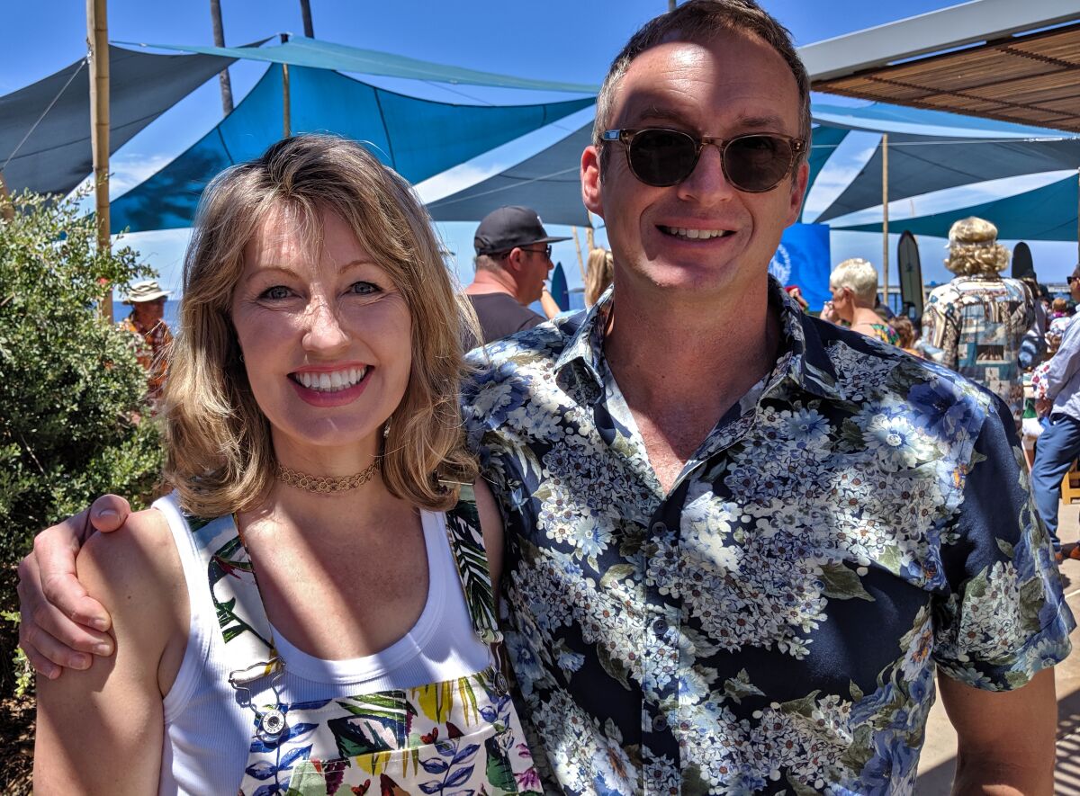 Dr. Catriona Jamieson and biotech executive John Hood, seen on Sunday, Aug. 18, at the 26th Annual Luau and Legends of Surfing Invitational. The fundraiser benefits UCSD Moores Cancer Center