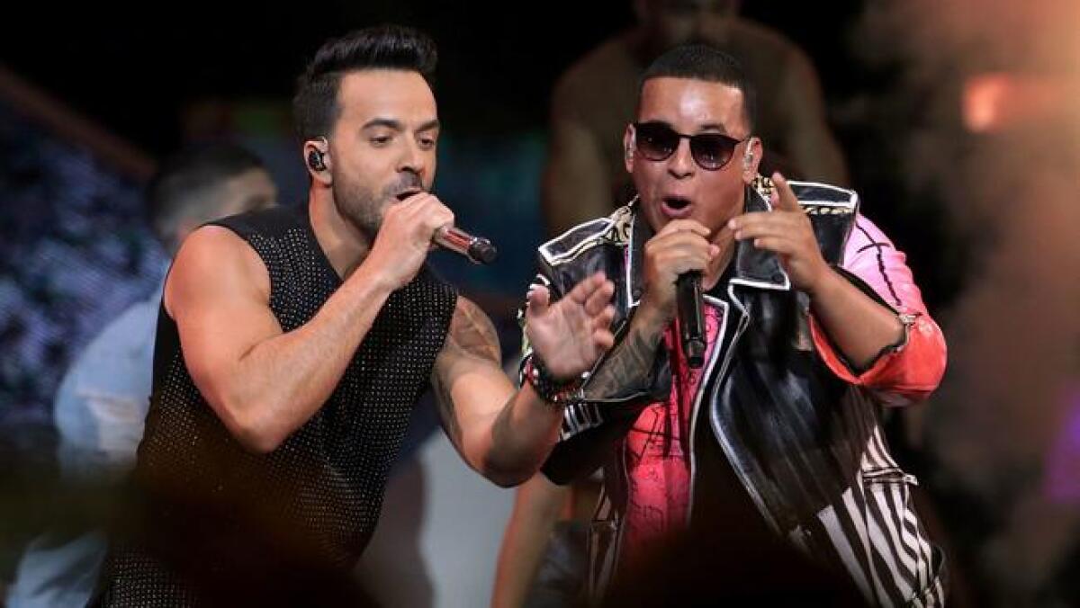 Luis Fonsi, left, and Daddy Yankee perform in Florida in April.