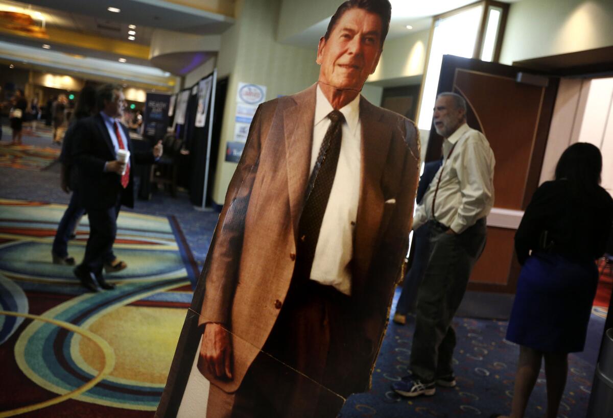 A cardboard cutout of President Reagan stands outside the room where the platform committee met at the Anaheim Marriott.