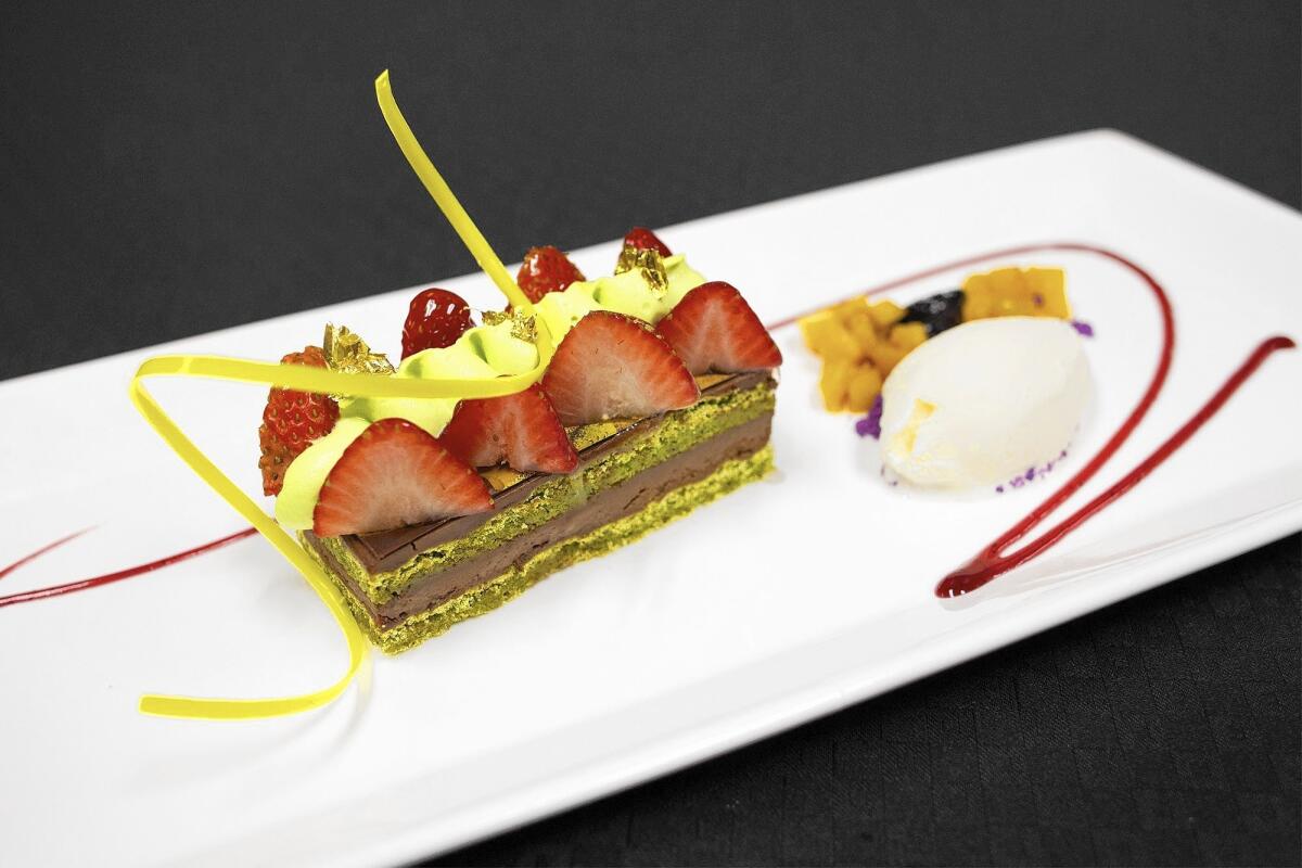 Strawberry pistachio torte is made with compote of farm pickled peaches, nectarines and cherries.